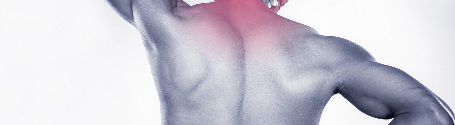 Athlete holding a sore shoulder and upper back